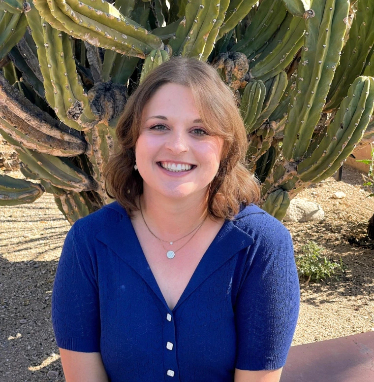 headshot of Nicole in front of a cactus